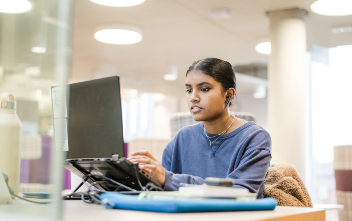 A student working on a laptop