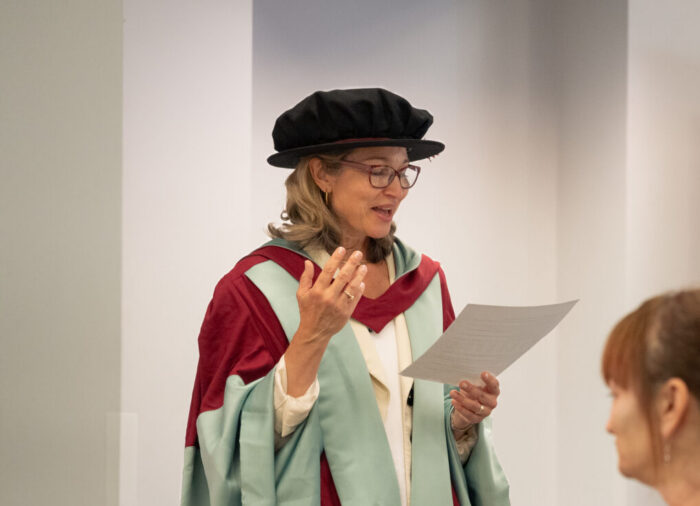 Margaret Korosec presents at lectern